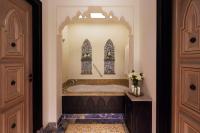a bathroom with a bath tub with a window at Jumeirah Mina Al Salam Dubai in Dubai