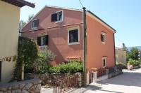 a house with a fence in front of it at Apartments by the sea Cres - 8095 in Cres