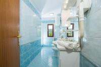 a bathroom with two sinks and two toilets at Apartments with a parking space Bozava, Dugi otok - 8124 in Božava