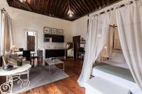 A bed or beds in a room at Isla Baja Suites