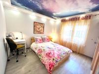 A bed or beds in a room at Camp Nou, Europa Fira - modern two-bedroom apartment with heating