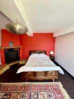 Posteľ alebo postele v izbe v ubytovaní Maison de campagne chaleureuse