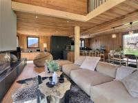 a living room with a couch and a table at Chalet Morzine, 5 pièces, 8 personnes - FR-1-627-66 in Morzine