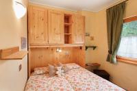 A bed or beds in a room at Terra Chalet Martina