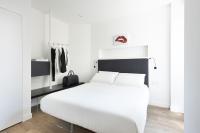 Posteľ alebo postele v izbe v ubytovaní Fiorentini Residence MILANO
