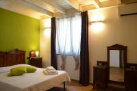 Łóżko lub łóżka w pokoju w obiekcie Agriturismo Torsivì
