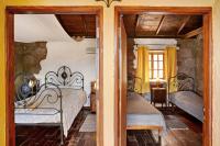Postel nebo postele na pokoji v ubytování Casa Rural - Ländliches Haus, Pepita La De Las Flores