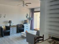 Posedenie v ubytovaní Appartement T3 avec balcon et parking, accès piscine, espaces sportifs - FR-1-195-96