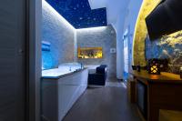 Televízia a/alebo spoločenská miestnosť v ubytovaní Stabiae Luxury Rooms