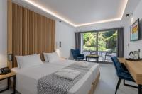 Posteľ alebo postele v izbe v ubytovaní Oceanis Beach Hotel