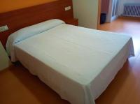 Posteľ alebo postele v izbe v ubytovaní Pension San Roque