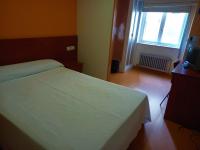 Posteľ alebo postele v izbe v ubytovaní Pension San Roque