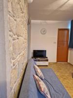 Televízia a/alebo spoločenská miestnosť v ubytovaní Jozefina Apartment