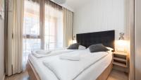 Posteľ alebo postele v izbe v ubytovaní Flatbook - City Center SPA Apartments Toruńska