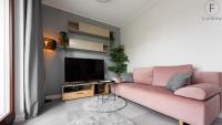 Televízia a/alebo spoločenská miestnosť v ubytovaní Flatbook - City Center SPA Apartments Toruńska