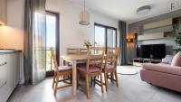 Televízia a/alebo spoločenská miestnosť v ubytovaní Flatbook - City Center SPA Apartments Toruńska