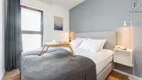 Posteľ alebo postele v izbe v ubytovaní Flatbook - City Center SPA Apartments Toruńska