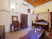 Ein Bett oder Betten in einem Zimmer der Unterkunft Heritage Home Guest House