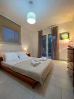 Posteľ alebo postele v izbe v ubytovaní Efi’s Apartment Nea Michaniona