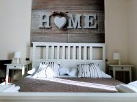 A bed or beds in a room at MIMI'S HOME casa per vacanze