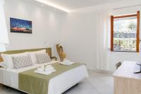 A bed or beds in a room at La Pigna Sorrento