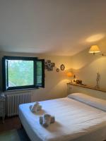 Posteľ alebo postele v izbe v ubytovaní Deliziosa casa immersa nella tranquillità.