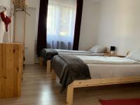 Łóżko lub łóżka w pokoju w obiekcie Piknik Apartmant