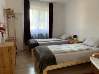 Łóżko lub łóżka w pokoju w obiekcie Piknik Apartmant