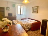 Posteľ alebo postele v izbe v ubytovaní Casa Vacanze La Casa di Nonna Libia vicino Saturnia