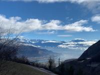 a view of a valley in the mountains at La coccinelle in Noyarey