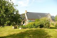 a large house with a yard with a house at Granite stone house with fireplace, Plouguerneau in Plouguerneau