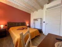 Łóżko lub łóżka w pokoju w obiekcie Agriturismo Torsivì
