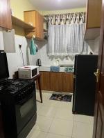 Trudy homes 1 bedroomにあるキッチンまたは簡易キッチン
