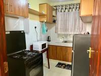 Trudy homes 1 bedroomにあるキッチンまたは簡易キッチン
