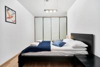 Posteľ alebo postele v izbe v ubytovaní Apartament Spiżowa z Balkonem Wrocław by Noclegi Renters
