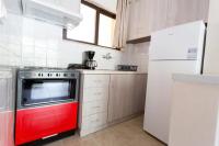 A kitchen or kitchenette at Vasileiou Apartments