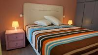 A bed or beds in a room at Vasileiou Apartments