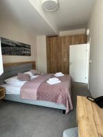 Posteľ alebo postele v izbe v ubytovaní Aparthotel Apartamenty Czarna Góra 410