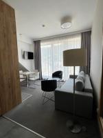 Televízia a/alebo spoločenská miestnosť v ubytovaní Aparthotel Apartamenty Czarna Góra 410
