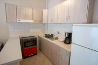 A kitchen or kitchenette at Vasileiou Apartments