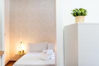 Łóżko lub łóżka w pokoju w obiekcie Home4u Casa del Tesoro I