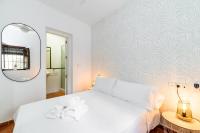 Łóżko lub łóżka w pokoju w obiekcie Home4u Casa del Tesoro I