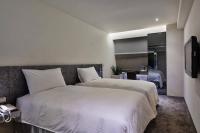 Hotels Here - Taipeiにあるベッド