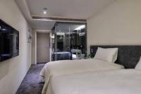 Hotels Here - Taipeiにあるベッド