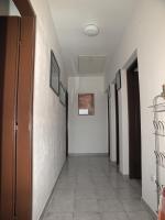 a hallway with white walls and a tile floor at Apartments with a parking space Betina, Murter - 17478 in Betina