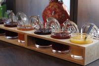 a shelf with jars of honey and other condiments at Hotel Jellentrup in Münster