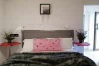 A bed or beds in a room at Casa Pepin