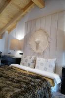 A bed or beds in a room at Casa Pepin