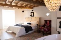 A bed or beds in a room at Casa Pepin