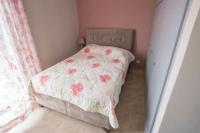 A bed or beds in a room at Vasileiou Apartments